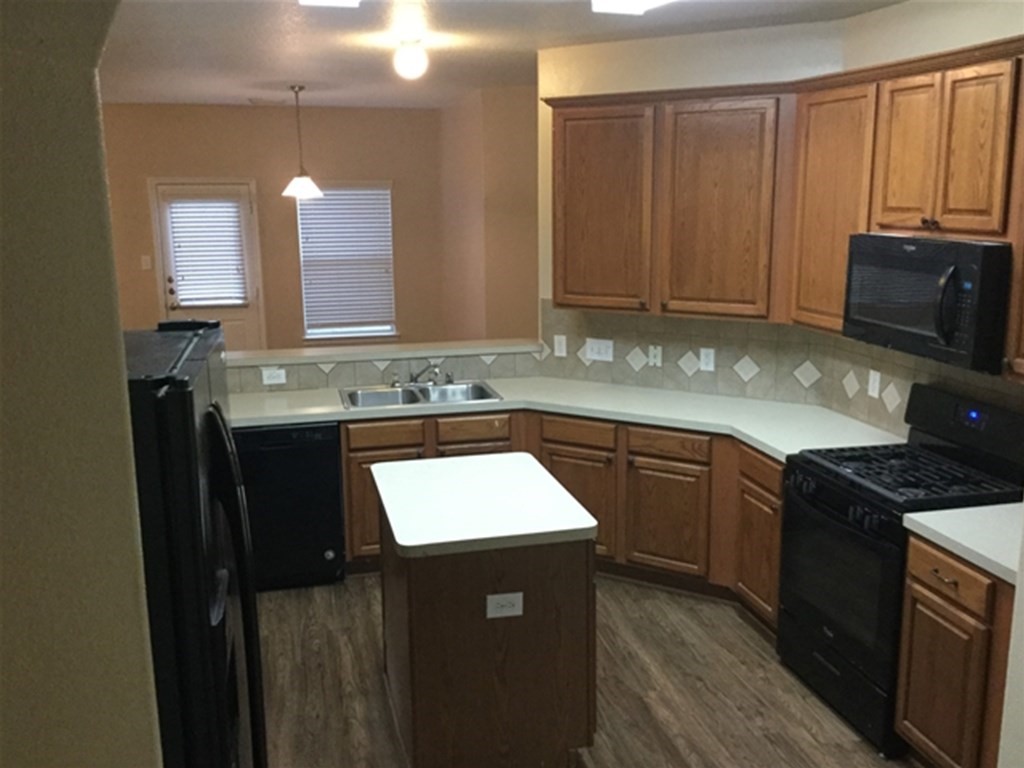 23511 Hidden Maple Drive Spring, TX 77373 - Photo 2 of 18 a kitchen with stainless steel appliances granite countertop a sink stove and cabinets