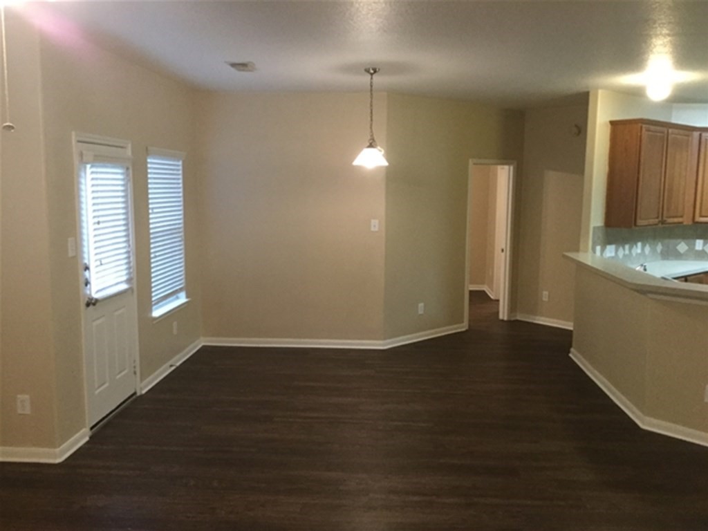 23511 Hidden Maple Drive Spring, TX 77373 - Photo 5 of 18 an empty room with wooden floor and windows