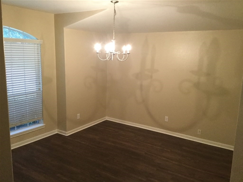 23511 Hidden Maple Drive Spring, TX 77373 - Photo 6 of 18 a view of a room with wooden floor and chandelier
