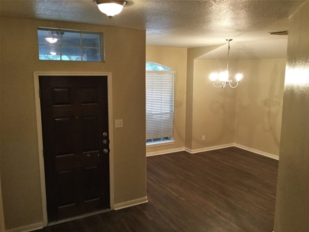 23511 Hidden Maple Drive Spring, TX 77373 - Photo 7 of 18 an empty room with wooden floor closet and windows