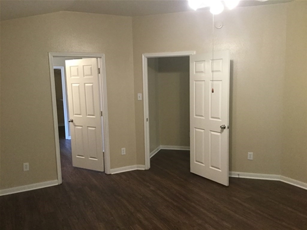 23511 Hidden Maple Drive Spring, TX 77373 - Photo 8 of 18 an empty room with wooden floor & closet area