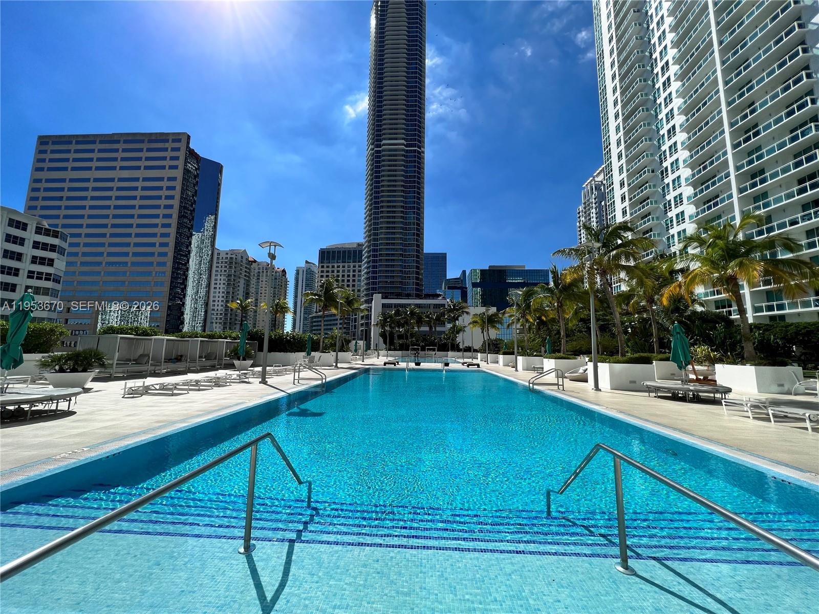 951 Brickell Avenue, Unit 3304 Miami, FL 33131 - Photo 16 of 28 a swimming pool with outdoor seating and yard