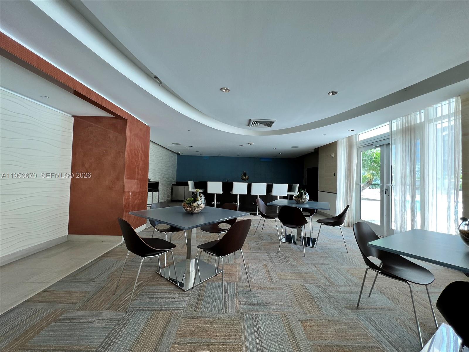 951 Brickell Avenue, Unit 3304 Miami, FL 33131 - Photo 26 of 28 a living room with lots of furniture and a large window