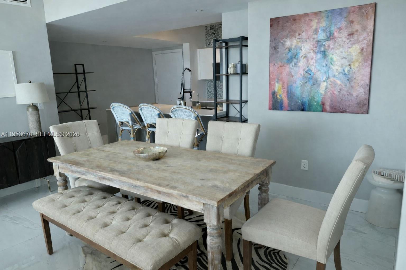 951 Brickell Avenue, Unit 3304 Miami, FL 33131 - Photo 3 of 28 a view of a dining room with furniture and wooden floor