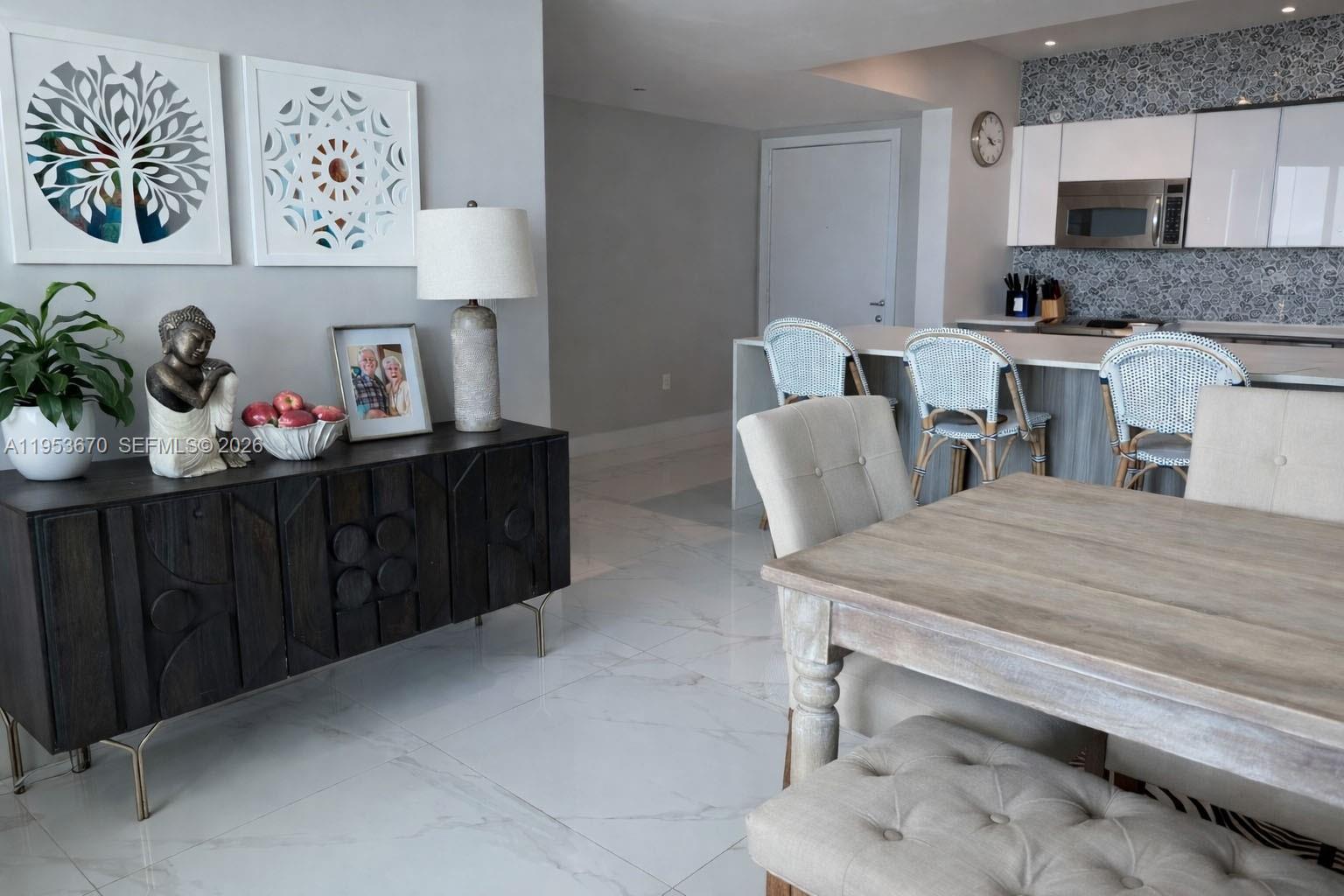 951 Brickell Avenue, Unit 3304 Miami, FL 33131 - Photo 4 of 28 a room with furniture and window