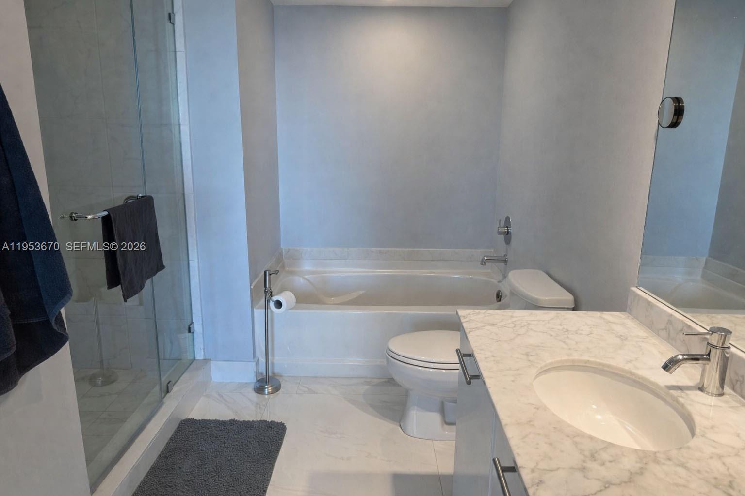 951 Brickell Avenue, Unit 3304 Miami, FL 33131 - Photo 7 of 28 a bathroom with a sink toilet and shower