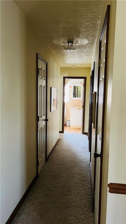 3356 Miola Road Clarion, PA 16214 - Photo 11 of 27 a view of a hallway with wooden floor and staircase