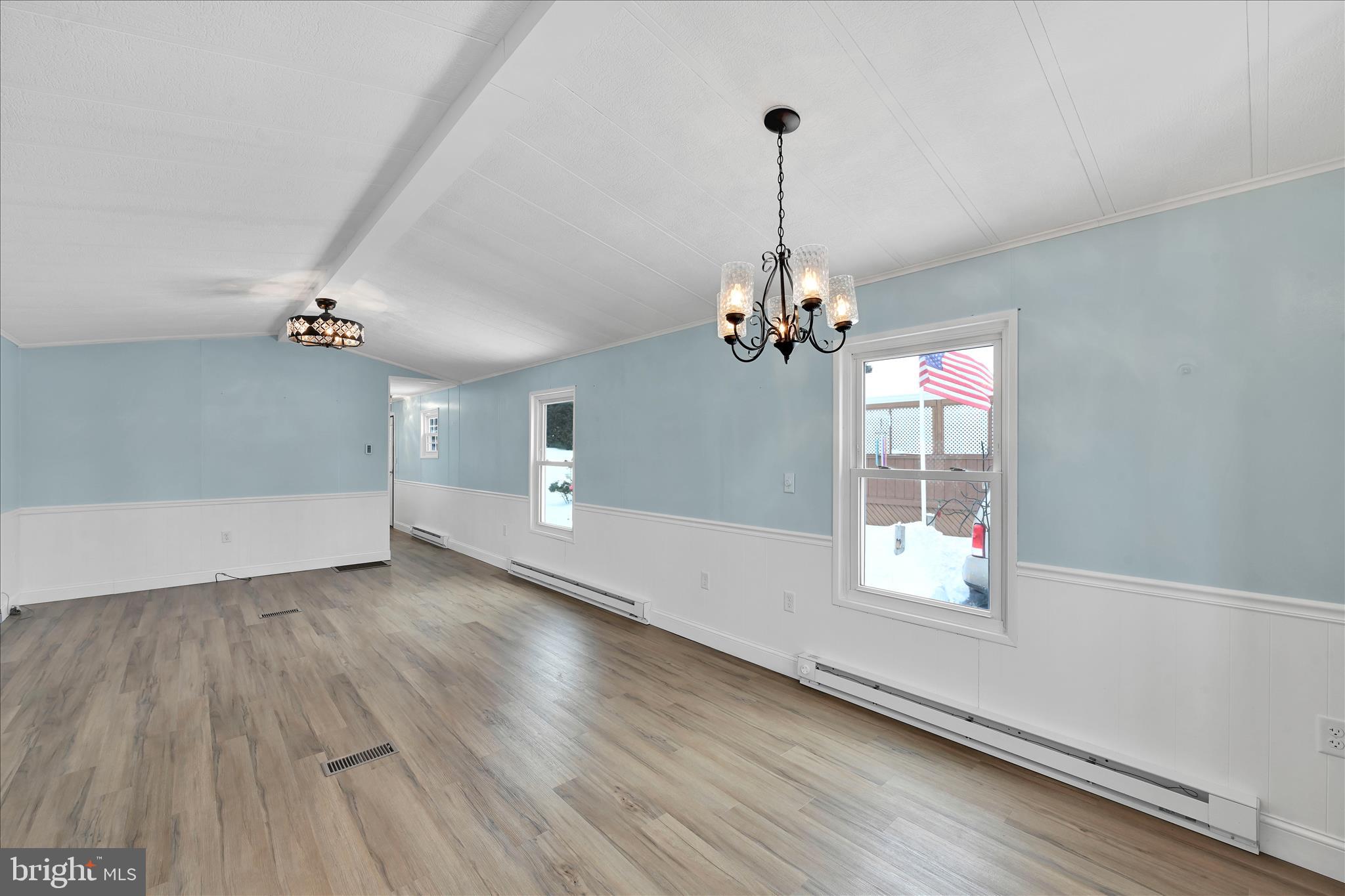 137 Meadow Valley Road Ephrata, PA 17522 - Photo 16 of 31 a view of a livingroom with a ceiling fan window and hardwood floor