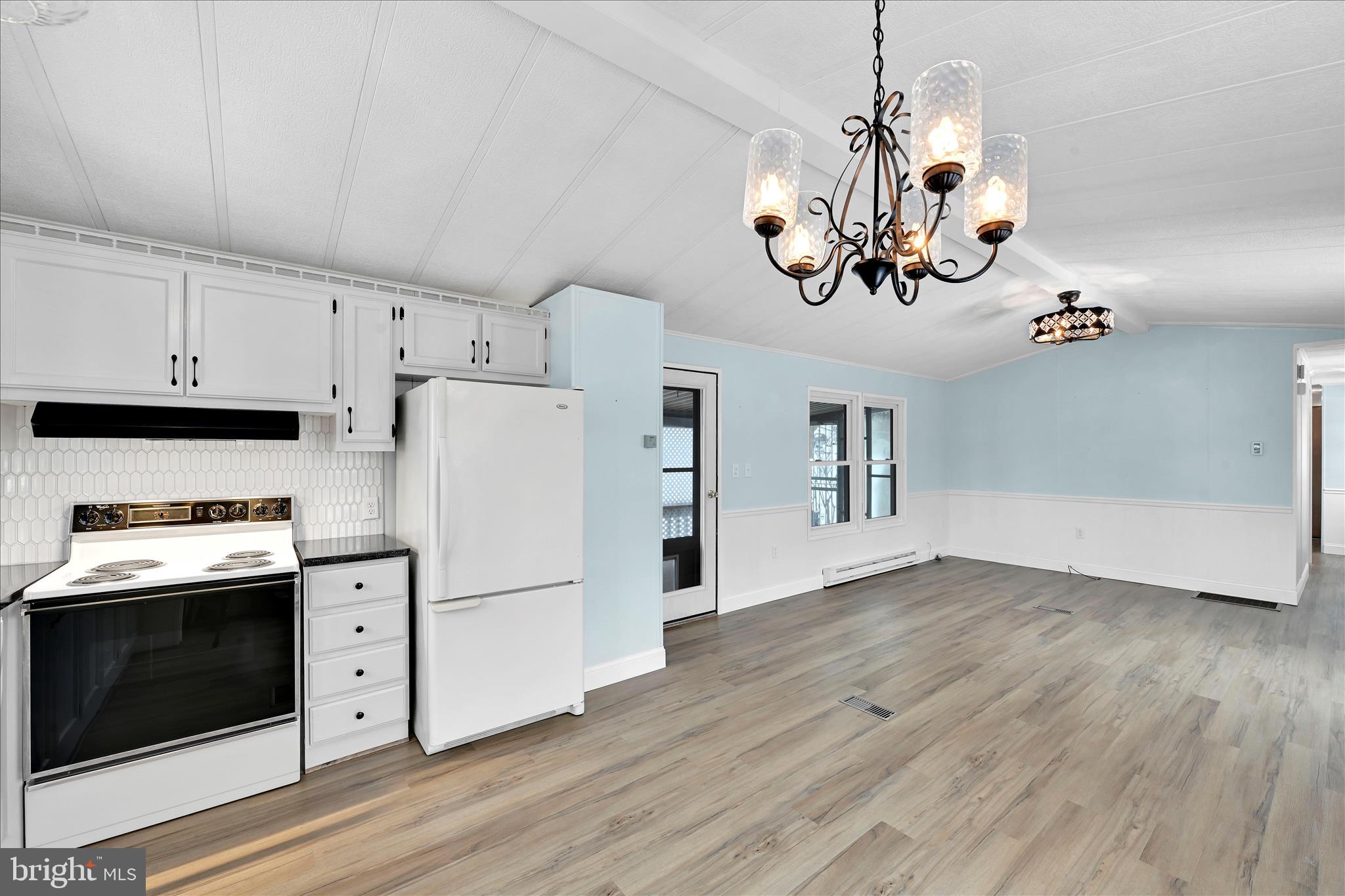 137 Meadow Valley Road Ephrata, PA 17522 - Photo 17 of 31 a kitchen with a refrigerator a stove a microwave and cabinets