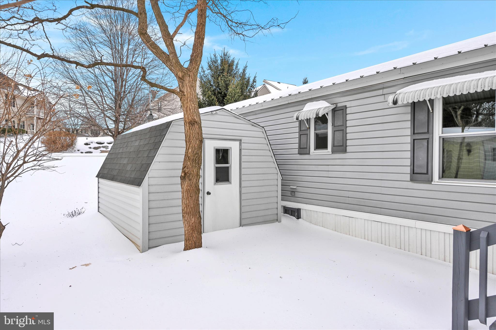 137 Meadow Valley Road Ephrata, PA 17522 - Photo 27 of 31 a view of a white house with a large tree