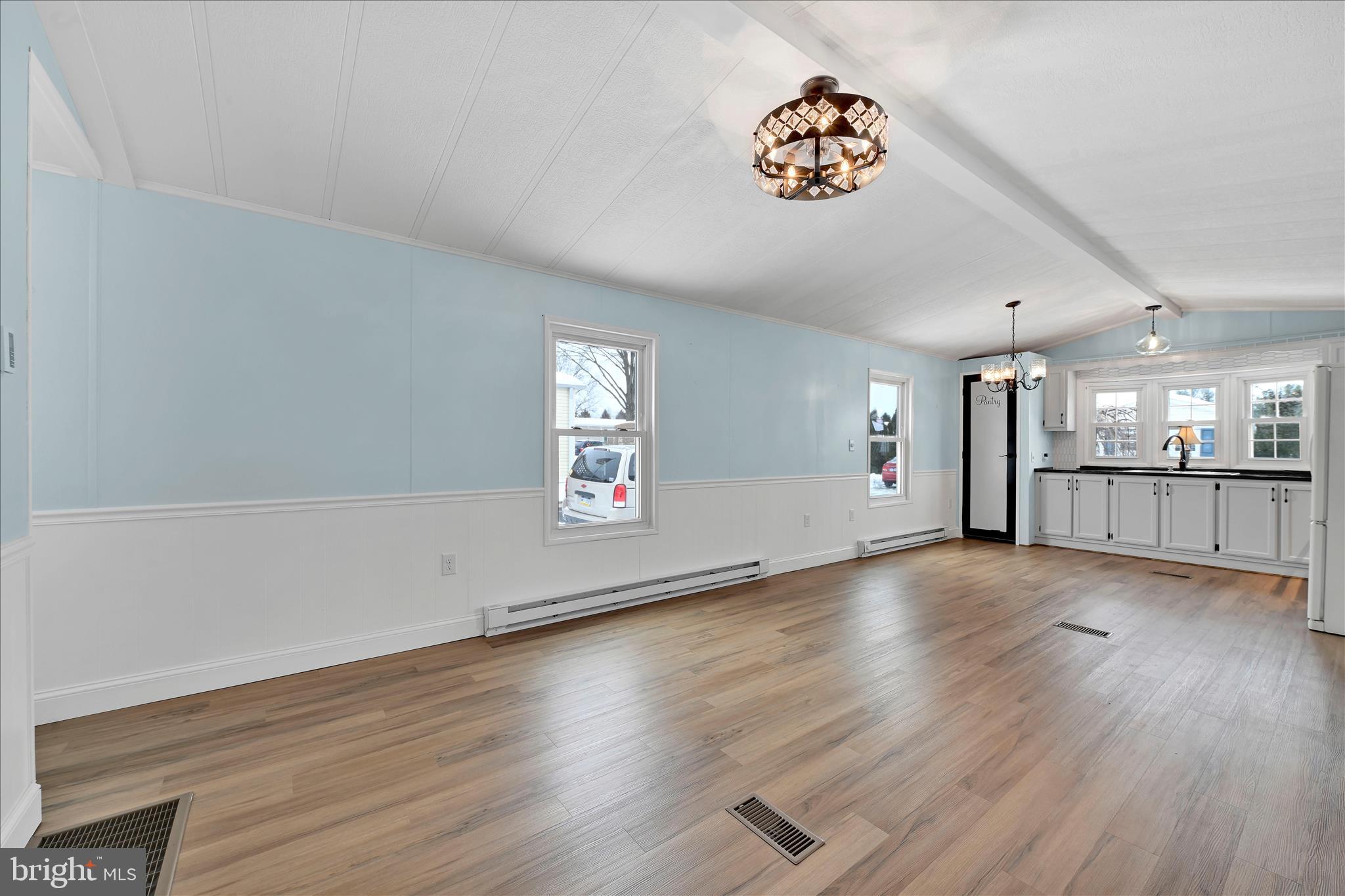 137 Meadow Valley Road Ephrata, PA 17522 - Photo 10 of 31 an empty room with wooden floor and windows