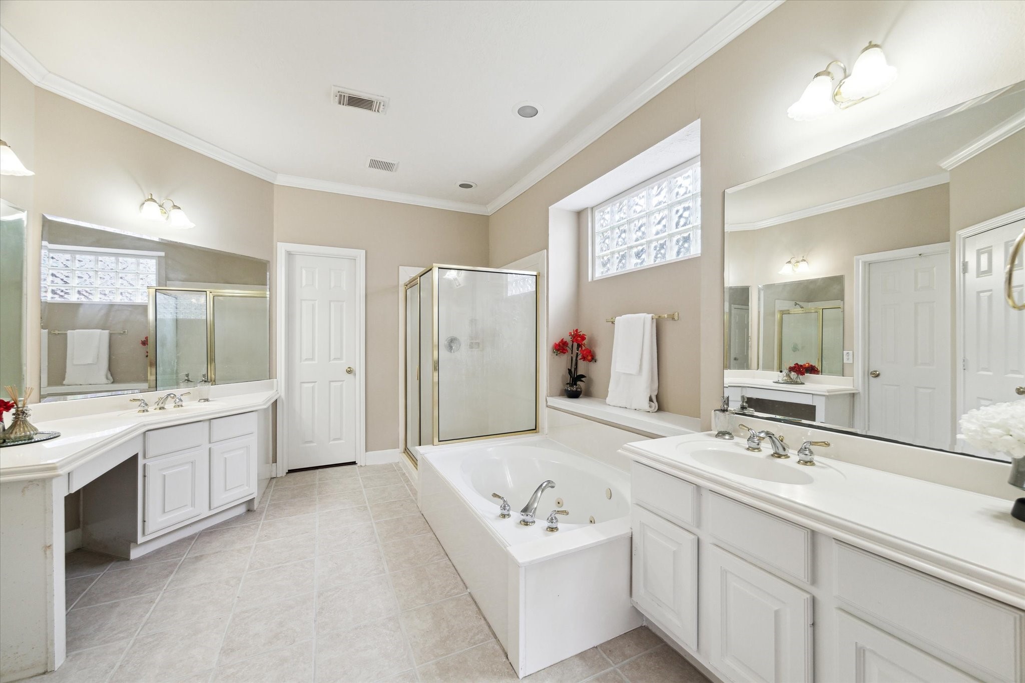 1818 Cross Spring Drive Sugar Land, TX 77479 - Photo 20 of 32 a bathroom with a double vanity sink mirror double and shower