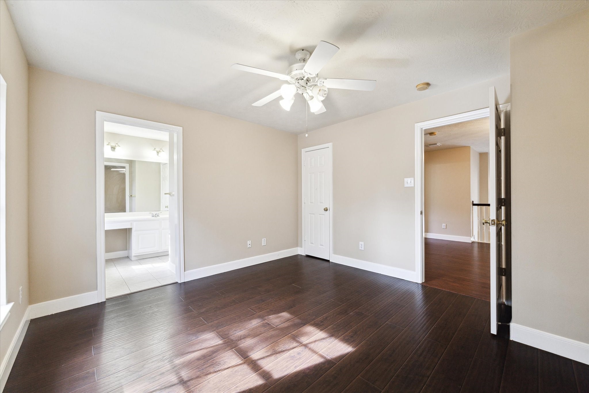 1818 Cross Spring Drive Sugar Land, TX 77479 - Photo 23 of 32 an empty room with wooden floor closet and windows