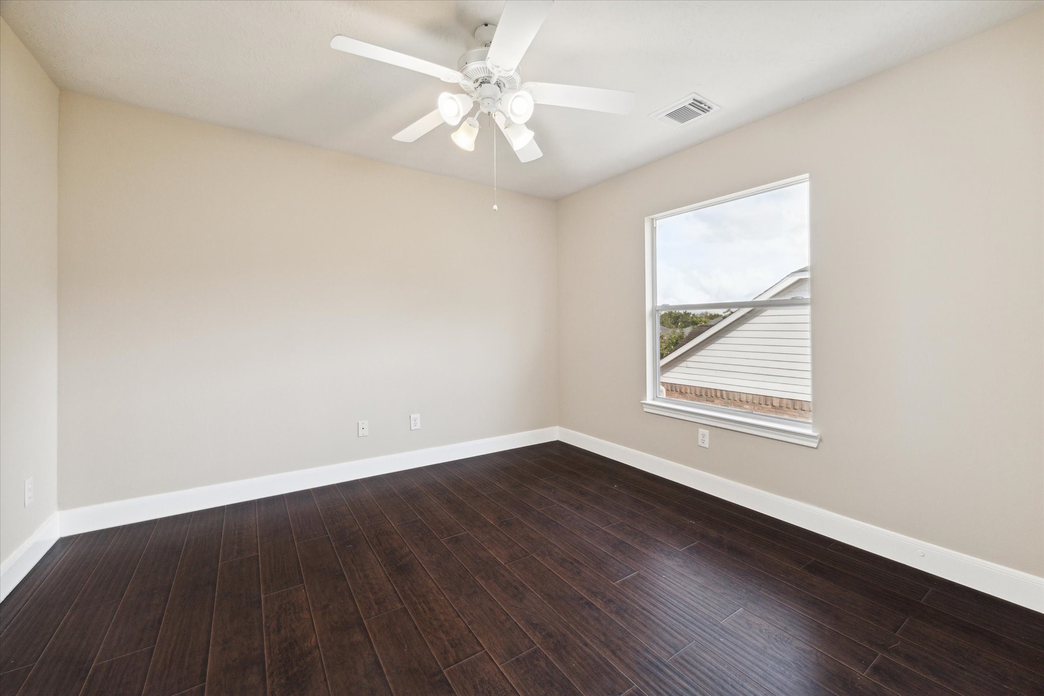 1818 Cross Spring Drive Sugar Land, TX 77479 - Photo 27 of 32 an empty room with wooden floor and windows