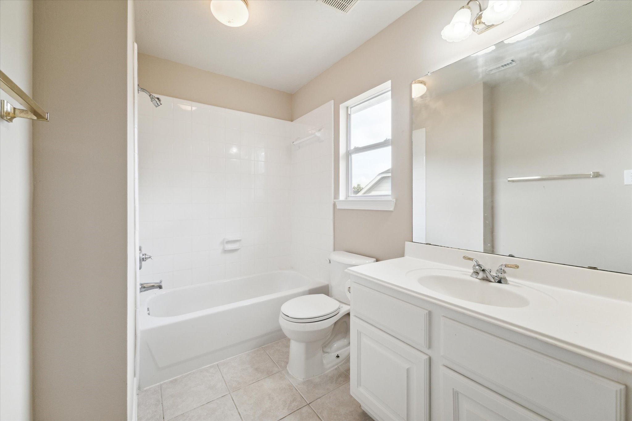 1818 Cross Spring Drive Sugar Land, TX 77479 - Photo 28 of 32 a bathroom with a sink a toilet and a large mirror