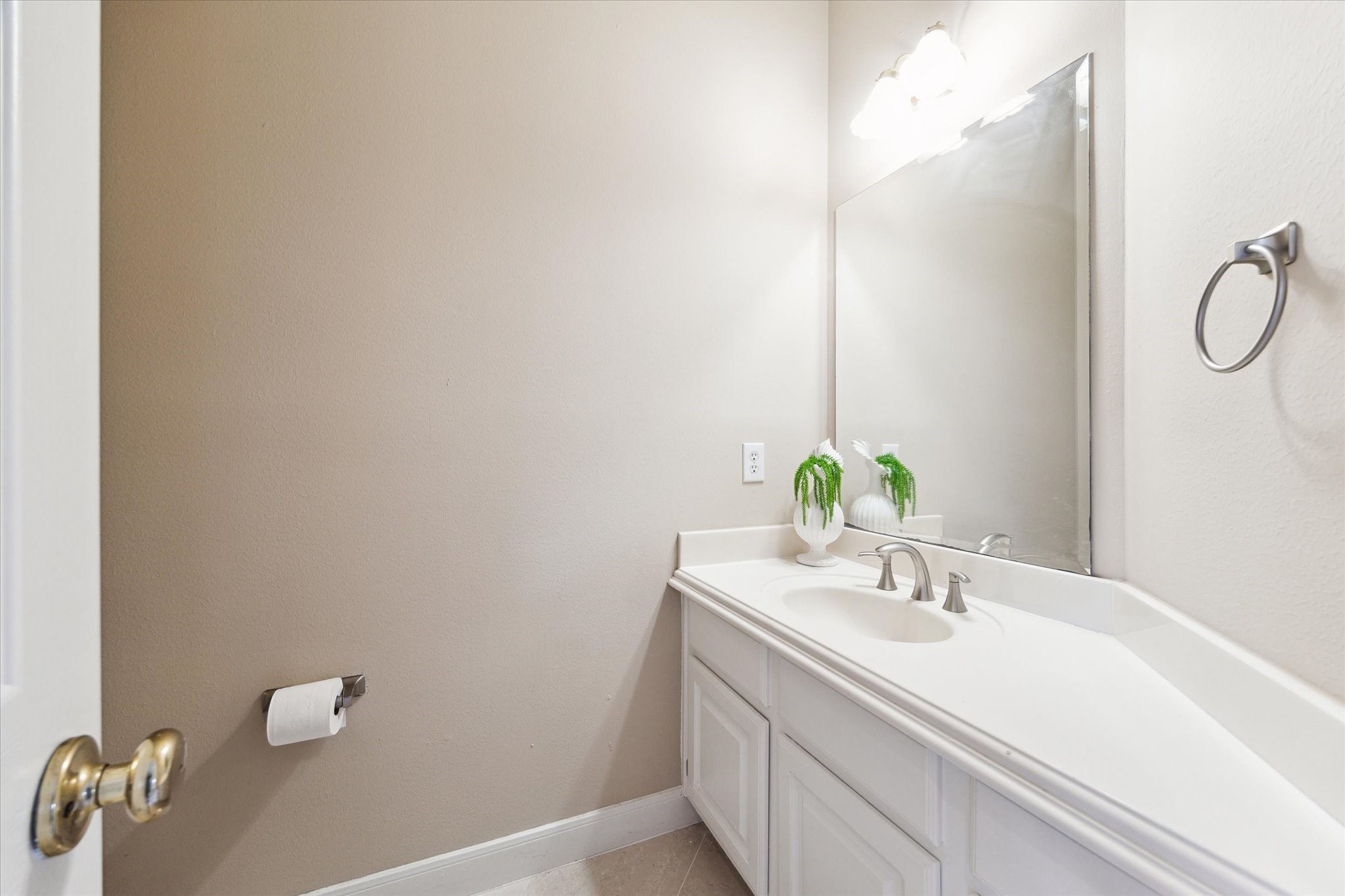 1818 Cross Spring Drive Sugar Land, TX 77479 - Photo 30 of 32 a bathroom with a sink and a mirror