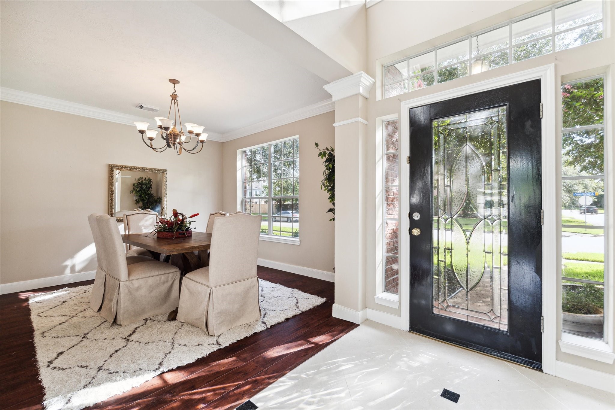 1818 Cross Spring Drive Sugar Land, TX 77479 - Photo 4 of 32 a living room with furniture and a chandelier