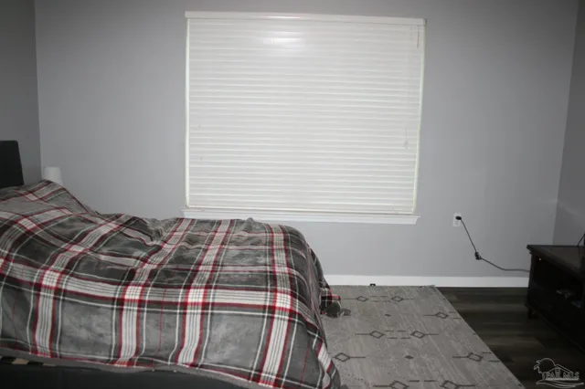 a bathroom with a sink toilet vanity and tub