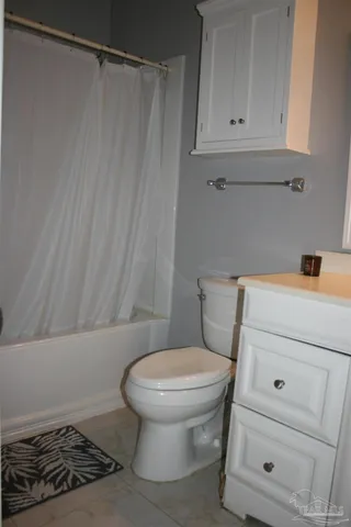 a view of a balcony with furniture