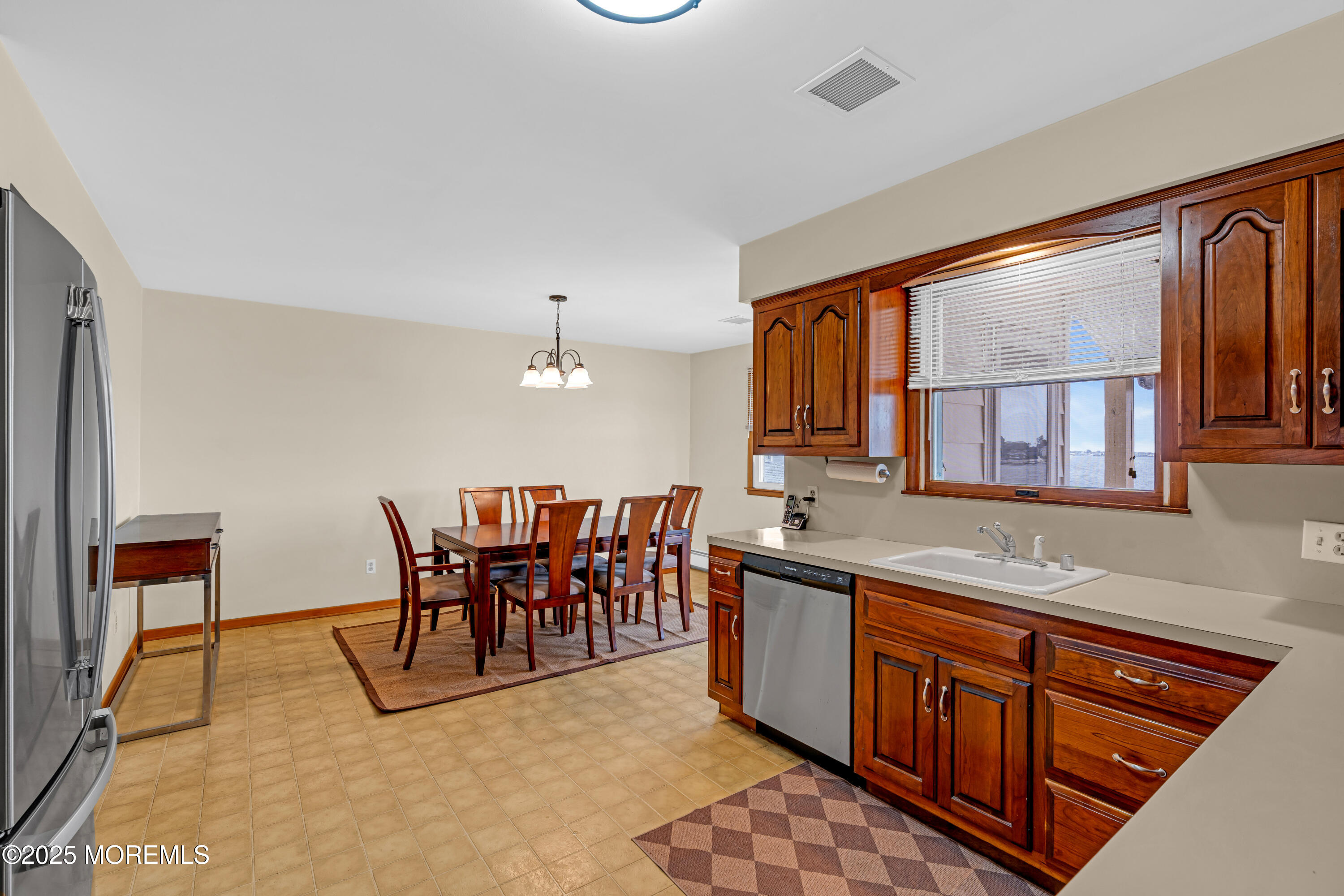 5 Bay Way Brick, NJ 08723 - Photo 11 of 61 a kitchen with stainless steel appliances granite countertop a stove a sink and a refrigerator