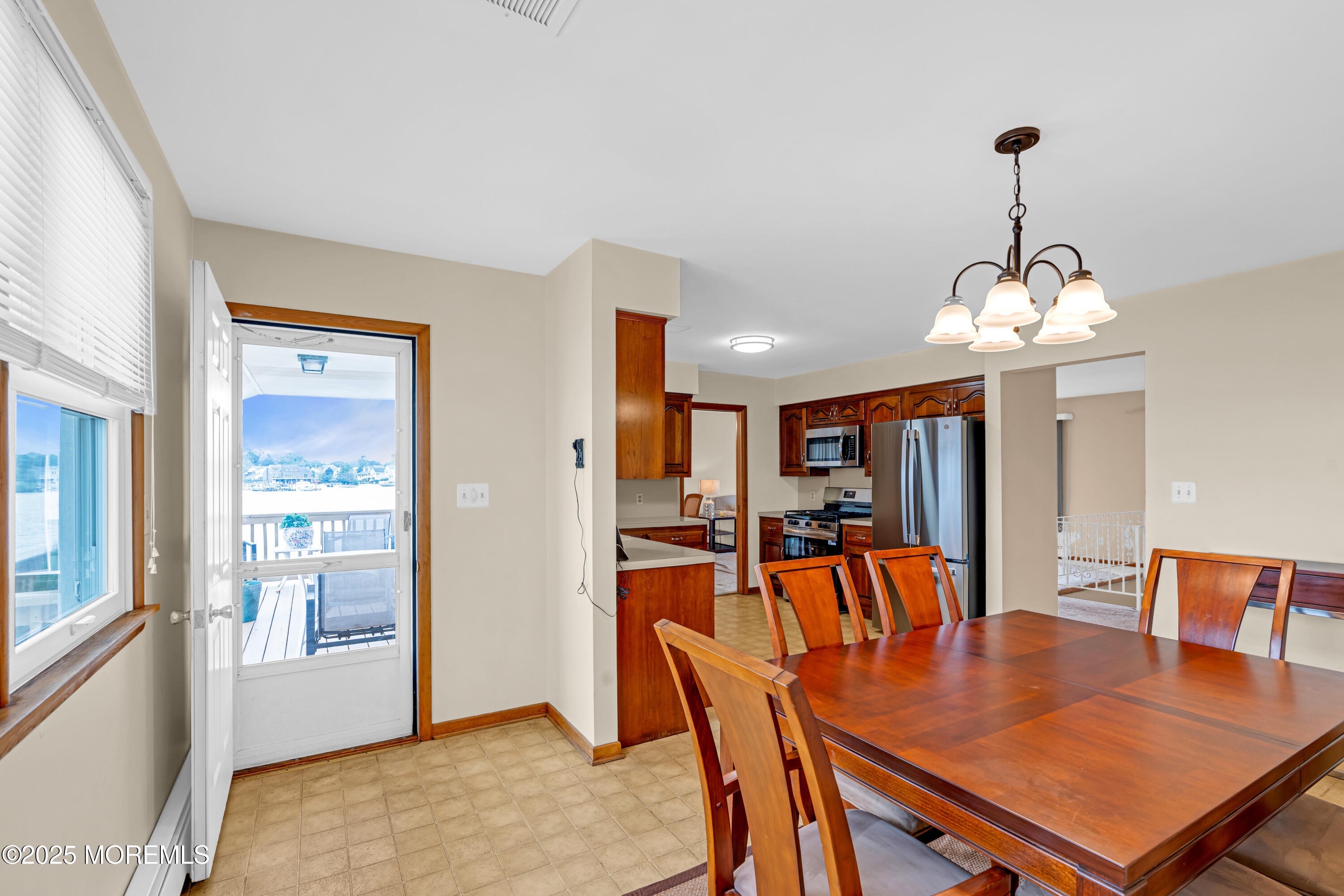 5 Bay Way Brick, NJ 08723 - Photo 14 of 61 a view of a dining room with furniture window and wooden floor