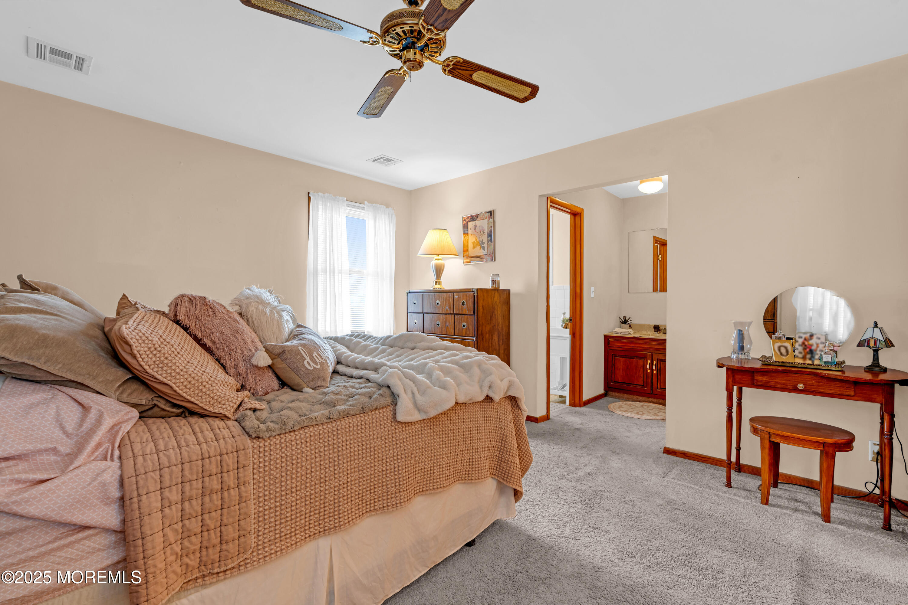 5 Bay Way Brick, NJ 08723 - Photo 30 of 61 a bedroom with a bed and a chandelier