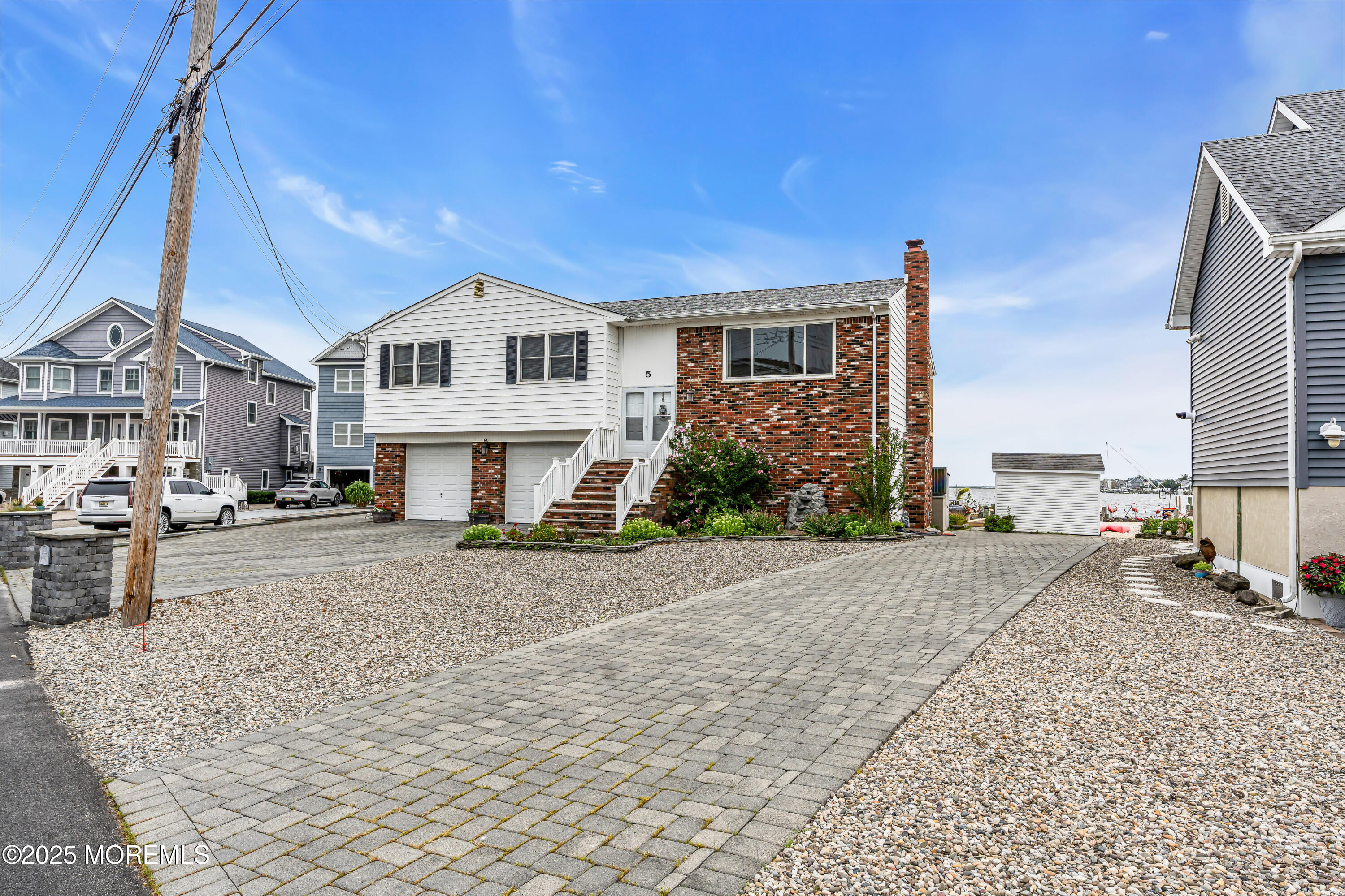 5 Bay Way Brick, NJ 08723 - Photo 4 of 61 a front view of a house with a yard