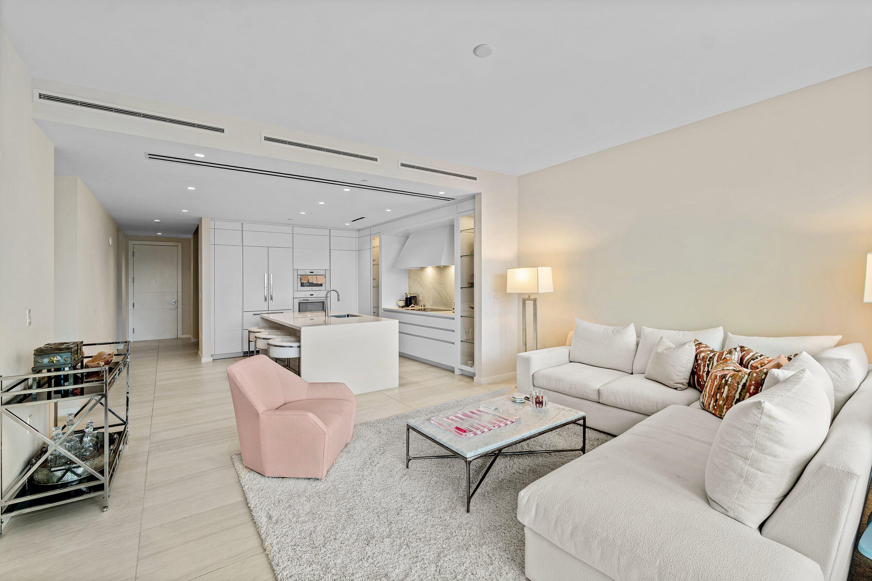 200 Southeast Mizner Boulevard, Unit 810 Boca Raton, FL 33432 - Photo 5 of 29 a living room with furniture and white walls