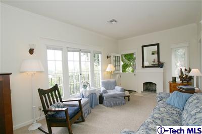 Undisclosed Address South Pasadena, CA 91030 - Photo 14 of 15 a living room with furniture two fireplace and a large window