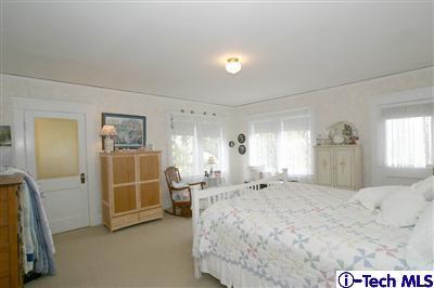 Undisclosed Address South Pasadena, CA 91030 - Photo 9 of 15 a spacious bedroom with a bed and a large window