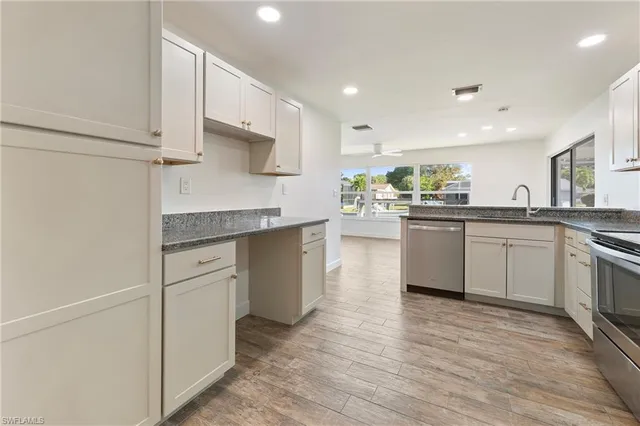 a view of an entryway with wooden floor