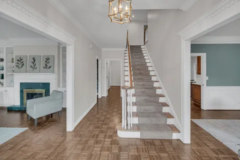 a view of a living room and a chandelier