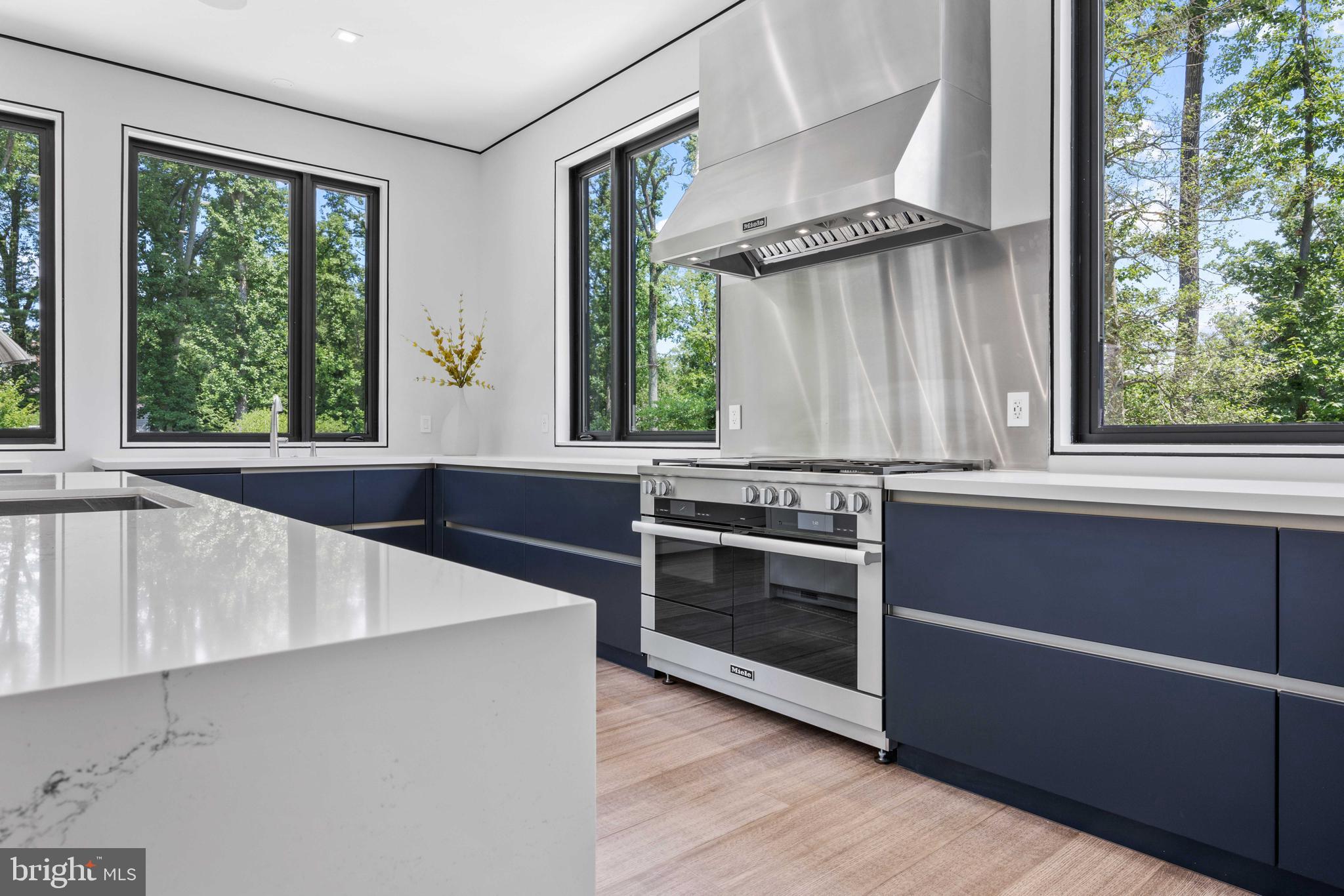 8801 Fernwood Road Bethesda, MD 20817 - Photo 19 of 48 a kitchen with wooden cabinets and a stove top oven