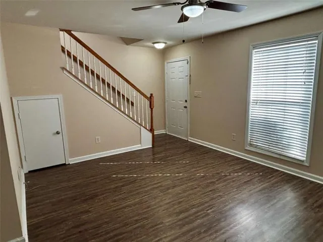 a view of an entryway with wooden floor