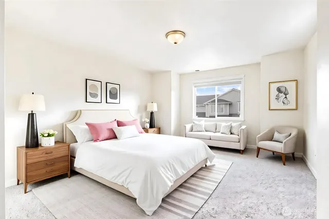 a bedroom with a bed and furniture