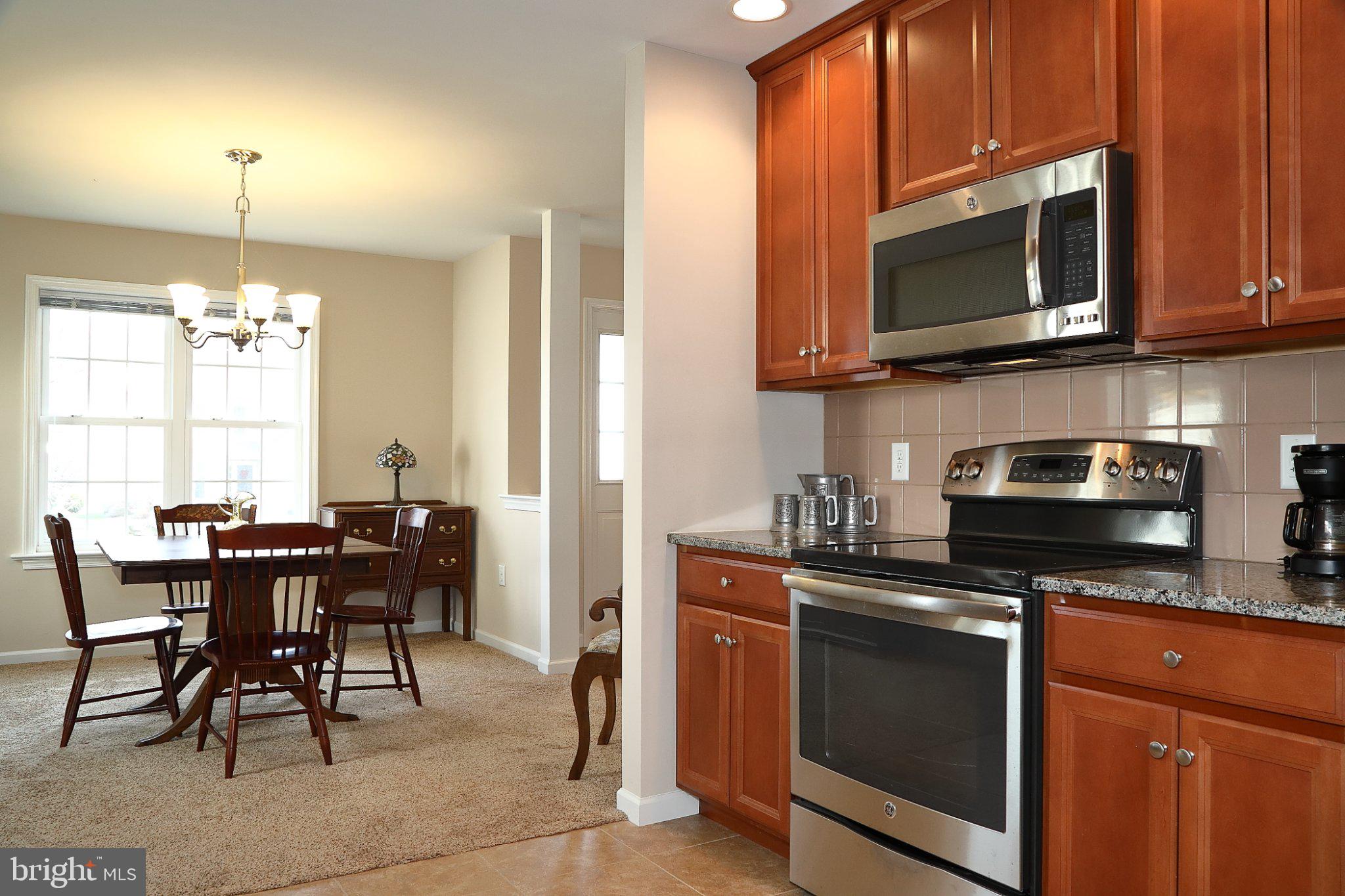 185 Waypoint Drive, Unit 236 Lancaster, PA 17603 - Photo 11 of 31 Warm kitchen with inviting dining area.