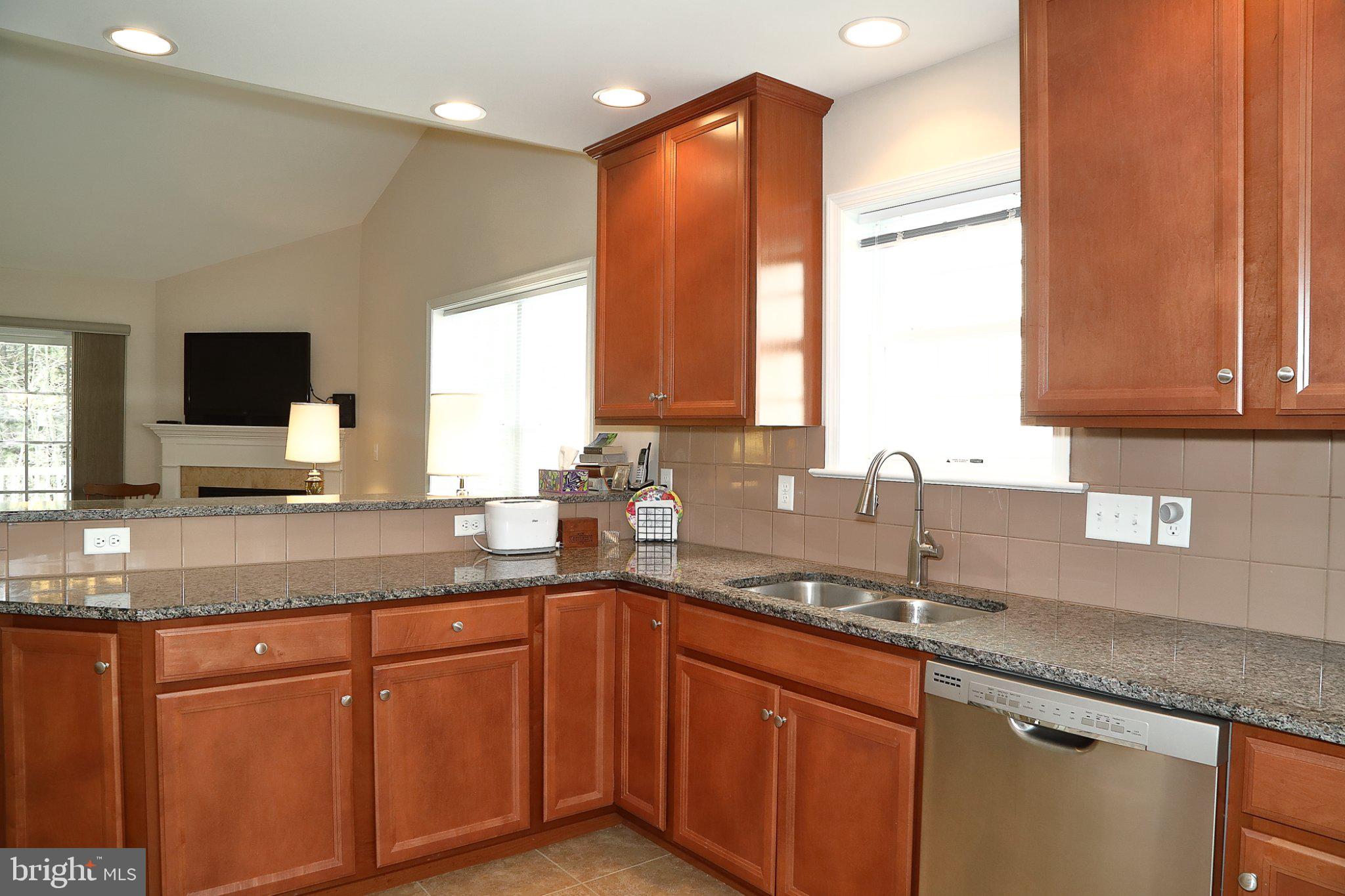 185 Waypoint Drive, Unit 236 Lancaster, PA 17603 - Photo 27 of 31 Modern kitchen with warm wood tones.