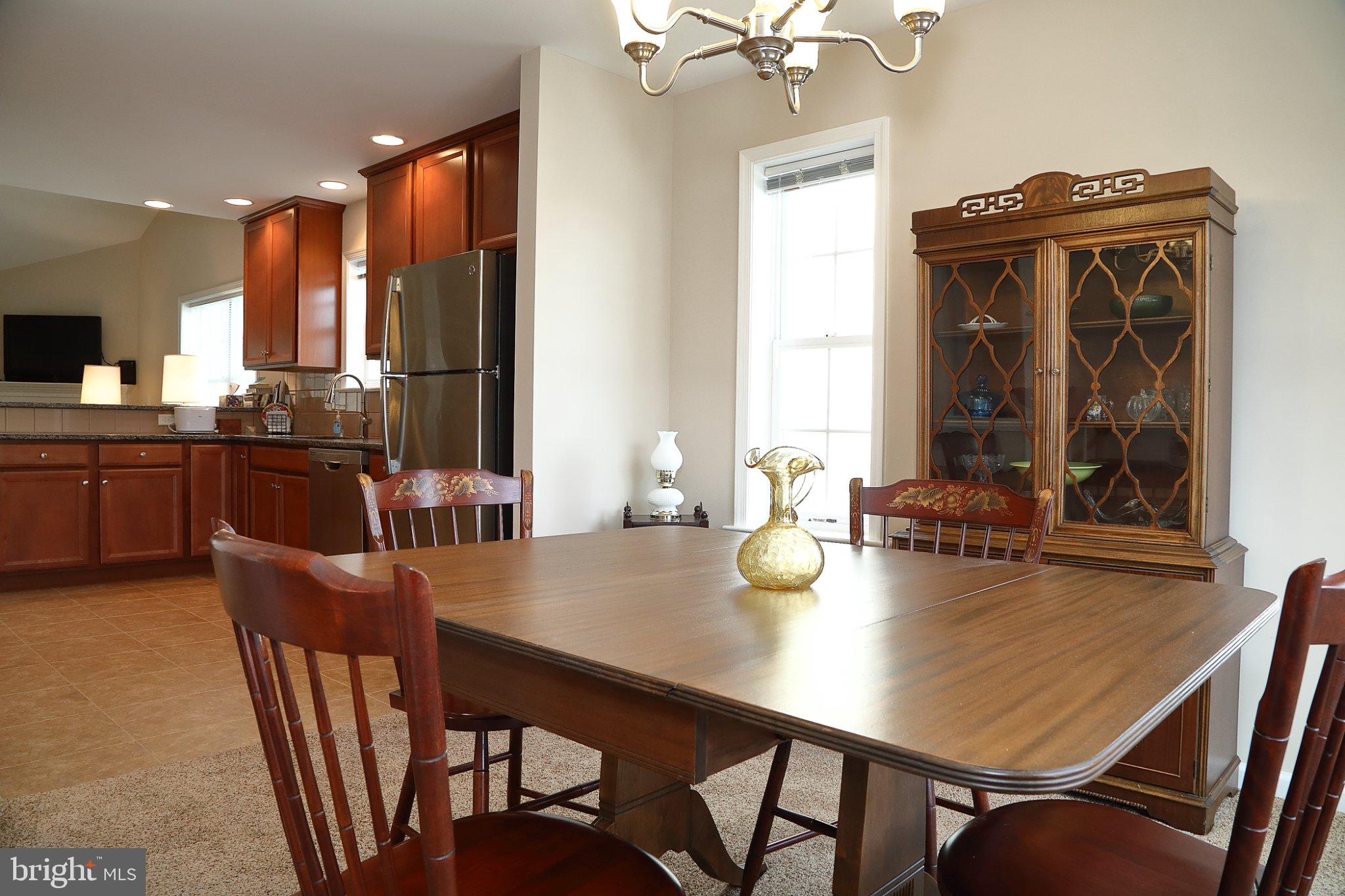 185 Waypoint Drive, Unit 236 Lancaster, PA 17603 - Photo 6 of 31 Inviting dining space with warm tones.