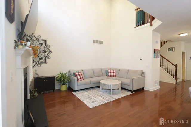 a outdoor sitting area with furniture and wooden floor