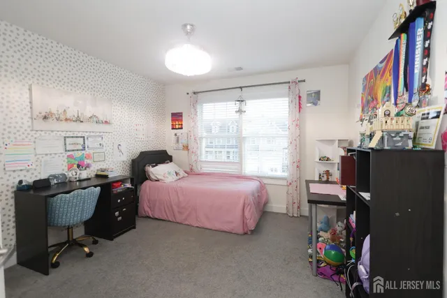 a bed room with a bed and a window