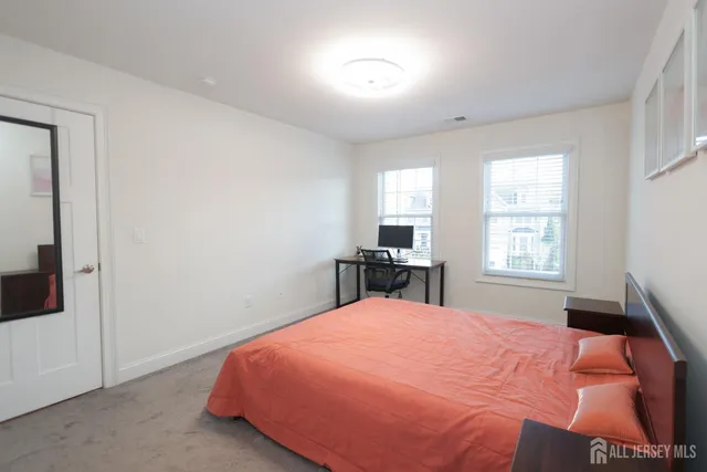 a view of hallway with wooden floor