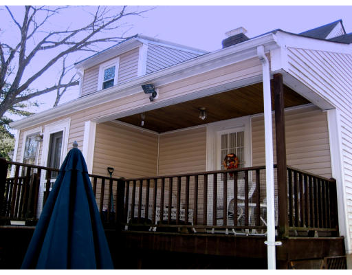 4 Cleveland Road Wellesley, MA 02481 - Photo 12 of 15 a view of a house with wooden fence