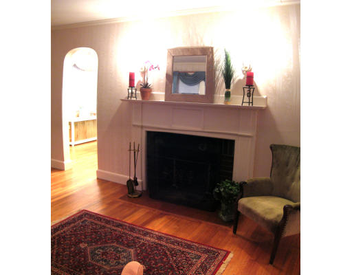 4 Cleveland Road Wellesley, MA 02481 - Photo 2 of 15 a living room with furniture and a fireplace