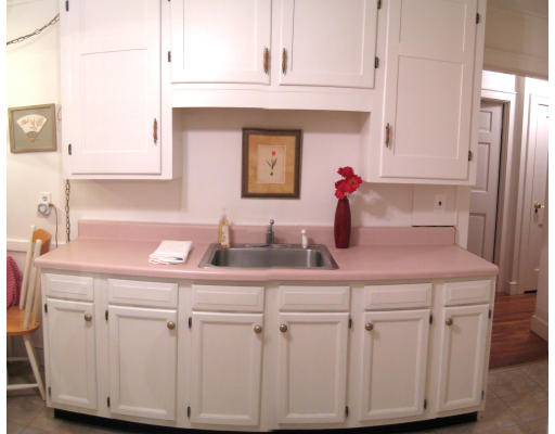 4 Cleveland Road Wellesley, MA 02481 - Photo 3 of 15 a kitchen with white cabinets and sink