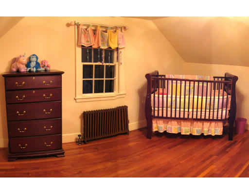 4 Cleveland Road Wellesley, MA 02481 - Photo 7 of 15 a view of a bedroom with wooden floor and window