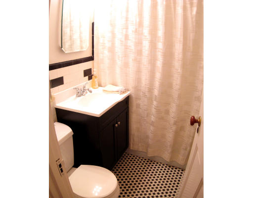 4 Cleveland Road Wellesley, MA 02481 - Photo 9 of 15 a bathroom with a sink a toilet and shower