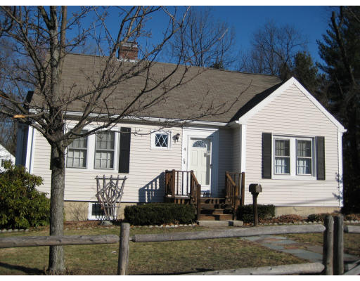 4 Cleveland Road Wellesley, MA 02481 - Photo 10 of 15 a front view of a house with garden