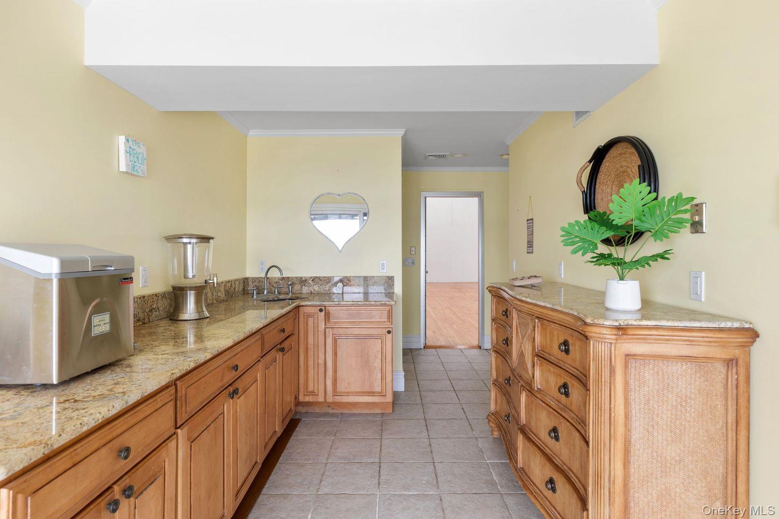 33 Beach Road Northport, NY 11768 - Photo 43 of 50 a spacious bathroom with a granite countertop sink a mirror and a bathtub
