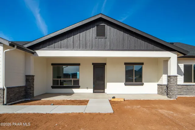 a front view of a house with a garage
