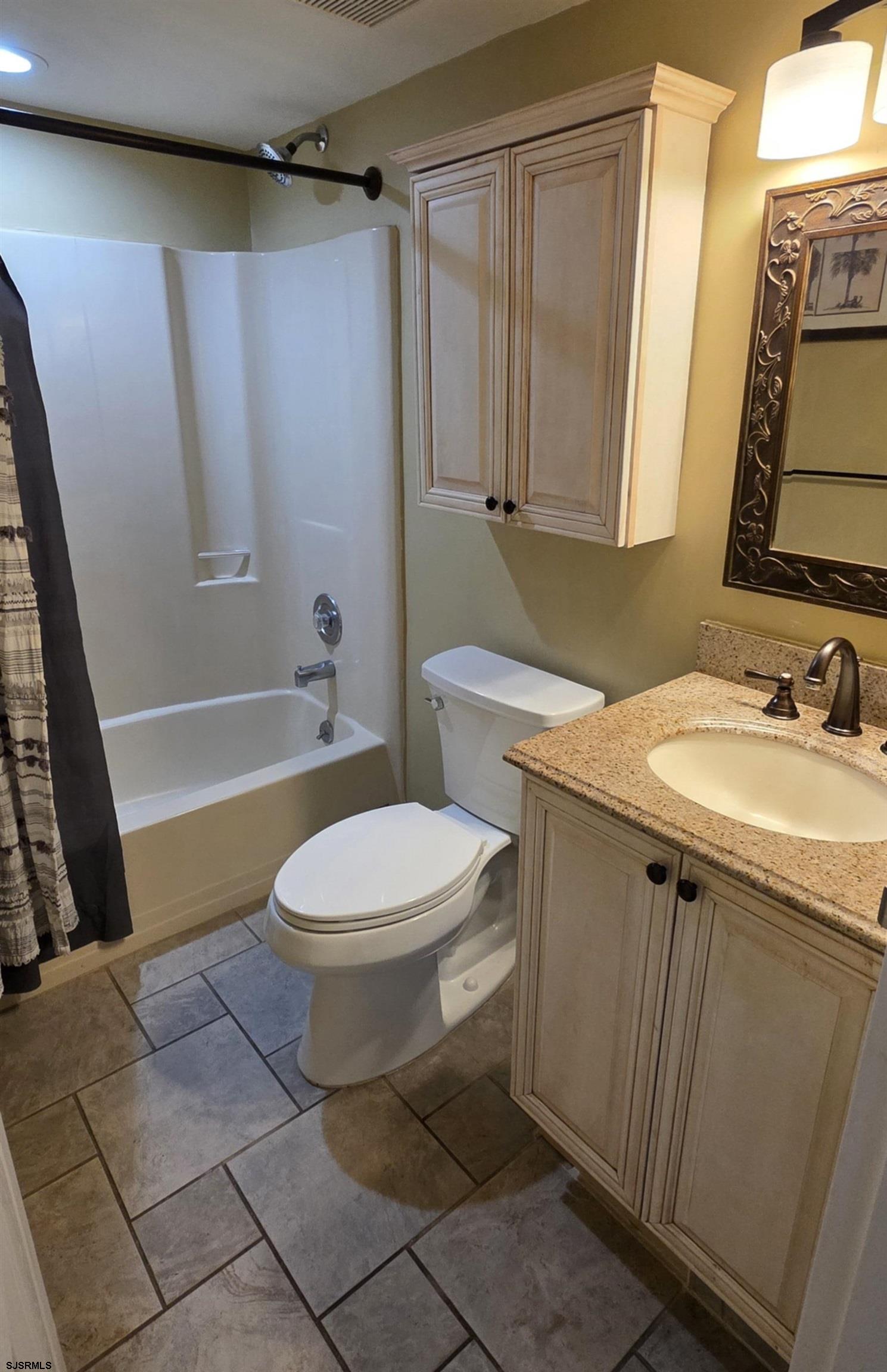 700 East Brigantine Avenue, Unit 2D Brigantine, NJ 08203 - Photo 14 of 21 a bathroom with a sink a toilet and shower